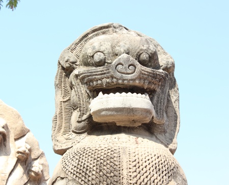 Ancient stone statue of the guardian creature in form of a lionの写真素材
