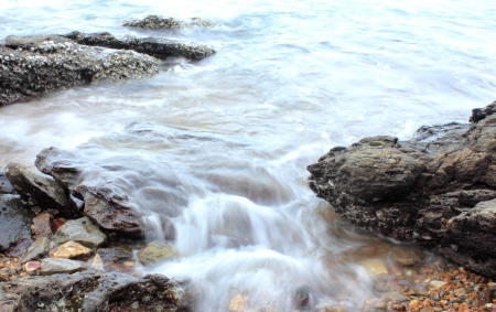 sea wave  against the rocksの写真素材