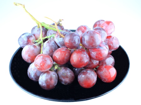 Cluster of grapes in a plateの写真素材