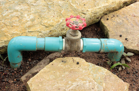 Water valve on a background groundの写真素材