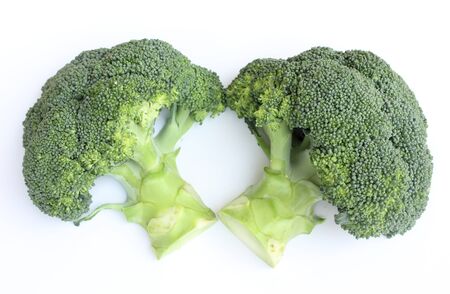 fresh green broccoli on white backgroundの写真素材