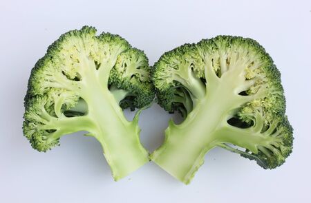 fresh green broccoli on white backgroundの写真素材