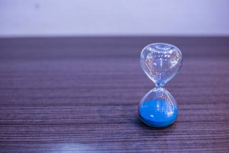 Blue sand clock on the table