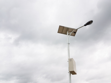 Solar cell lamp under the cloudy skyの写真素材