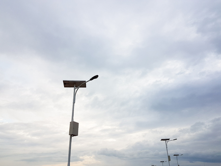 Solar cell lamp under the cloudy skyの写真素材