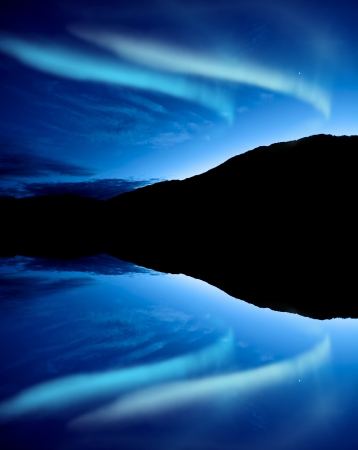 Northern lights Aurora borealis reflection on a lakeの写真素材