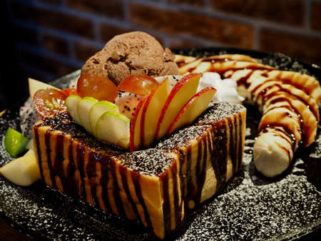 Chocolate toast with ice cream and fruit.の写真素材