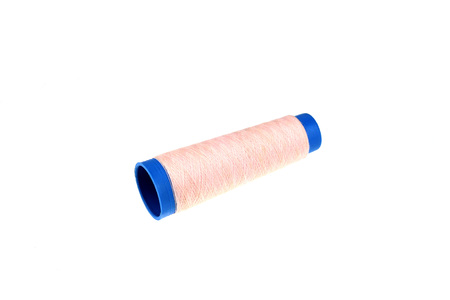 Pink thread roll isolatedの写真素材