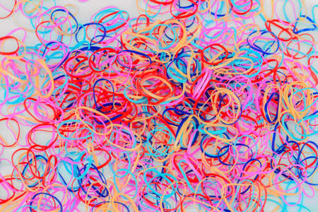 A heap of colourful rubber bandの写真素材