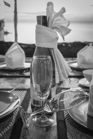 Setting dining table with white wine in the eveningの写真素材