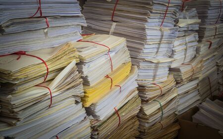 A pile of used paper are tied