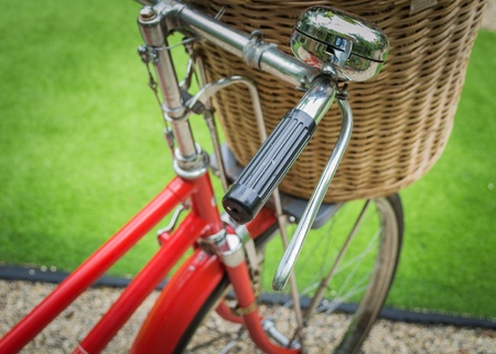 Vintage a red bicycle with weaving basket infrontの写真素材