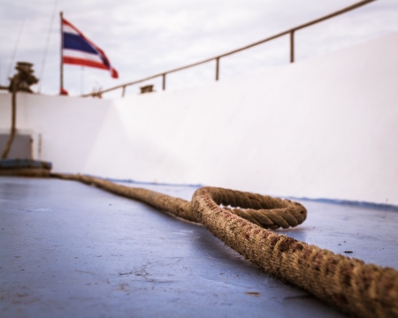 A long rope on a cruise with thailand national flagの写真素材