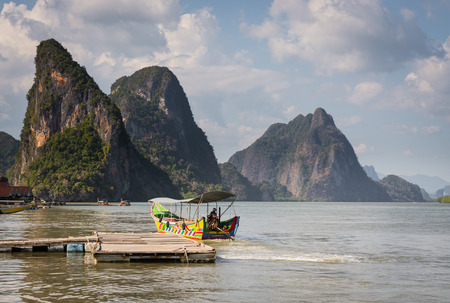 Long tail boat at floating pier in Phang Nga Bay, Thailandの写真素材