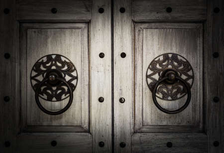 Retro wooden door with metal handle backgroundの写真素材