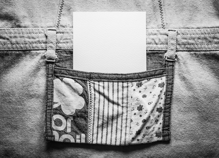 Close up white card in a pocket of a cloth in black and white tone