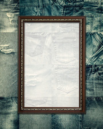 Vintage picture frame on collage set of jeans backgroundの写真素材