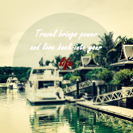 Meaningful quotes on a yacht marina background, Travel brings power and love back into your life.の写真素材