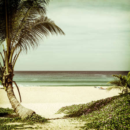 Natural seascape with a woman relaxing on the beach on vintage paper background