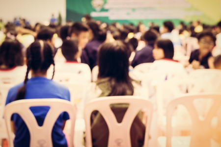 Blurred crowd of children in the hall for backgroundの写真素材