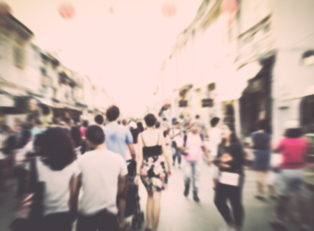 Motion of blurred people on old town street in vintage style backgroundの写真素材