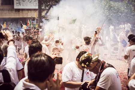 PHUKET- OCT 07 : Taoism participants in a street procession of the Phuket Vegetarian Festival on Oct 07, 2016 in Phuket, Thailand. During festival devotees abstain from eating meat to appease the God.のeditorial素材