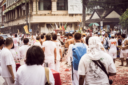 PHUKET- OCT 07 : Taoism participants in a street procession of the Phuket Vegetarian Festival on Oct 07, 2016 in Phuket, Thailand. During festival devotees abstain from eating meat to appease the God.のeditorial素材