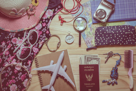 Travel concept, Set of clothes and  accessory for traveler on wooden plank backgroundの写真素材