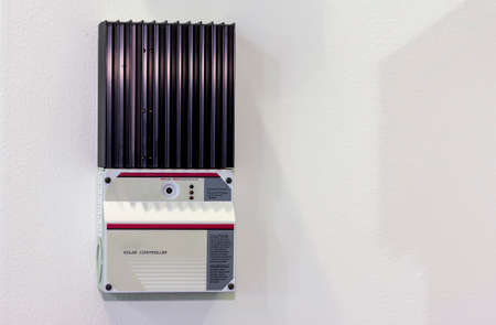 Solar Controller equipment for electric charge of solar energy industrial on white wall with copy spaceの写真素材