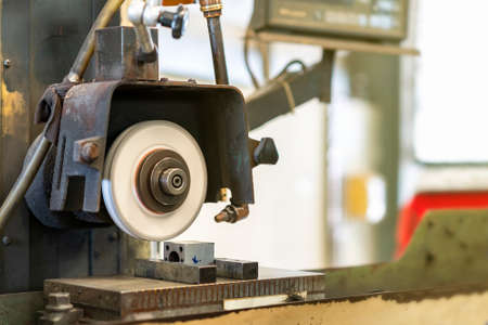 Close up cutting or grinding wheel during rotating or working with product on high accuracy and...