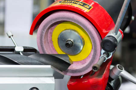 End mill or drills resharpening by sharpener machine at factoryの写真素材