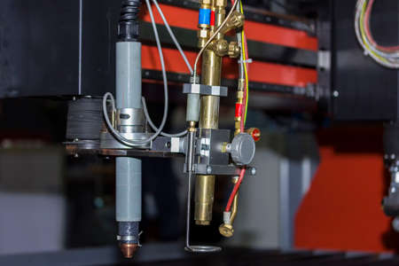 Close up plasma head of high precision cnc gas plasma cutting machine