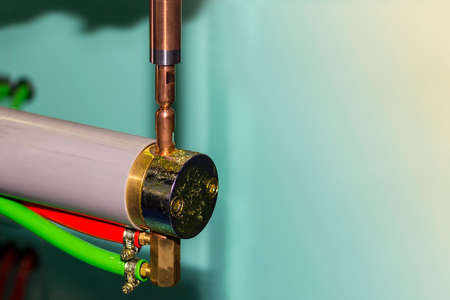 Close up electrode spot welding machine for industrial work at workshop with copy spaceの写真素材