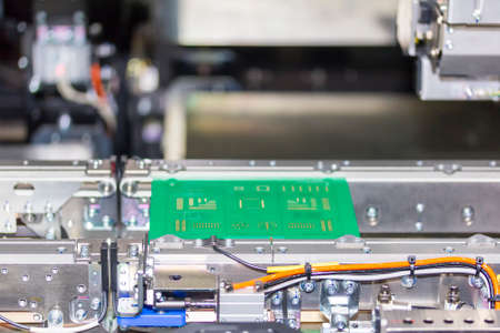 close up print circuit board (pcb) on conveyor of PCB LED SMT automatic pick and place machine for...