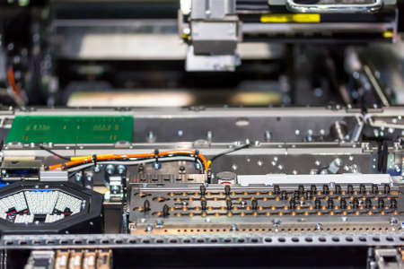 Close up inside automatic PCB LED SMT pick and place machine of high technology and accuracy for...