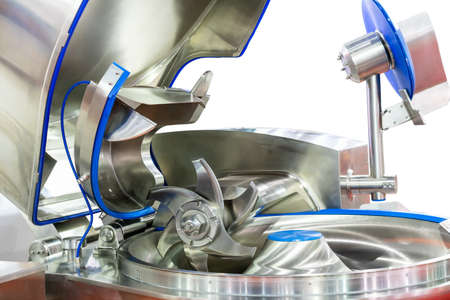Close up Ploughshare or blade of High technology and multipurpose automatic food making machine for industrial as grinding chopping or cutting and mixing (bowl type) isolated on white background with clipping pathの写真素材