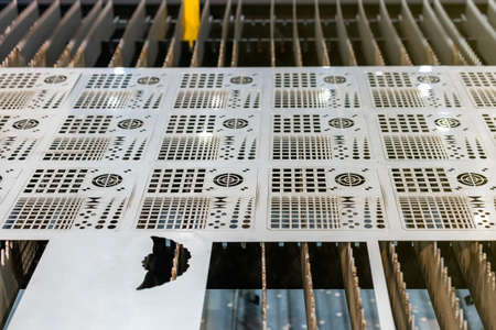 Metal sheet or plate part made from automatic and high precision laser cutting process in industrial...