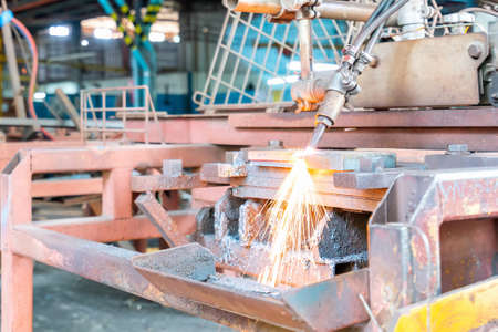 Close up torch or tip and flame with sparkle form oxygen and acetylene of gas cutting machine for industrial at factoryの写真素材