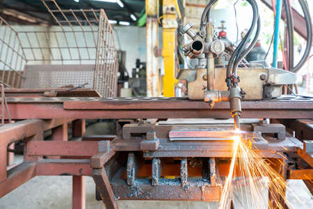 Close up torch or tip and flame with sparkle form oxygen and acetylene of gas cutting machine for industrial at factoryの写真素材