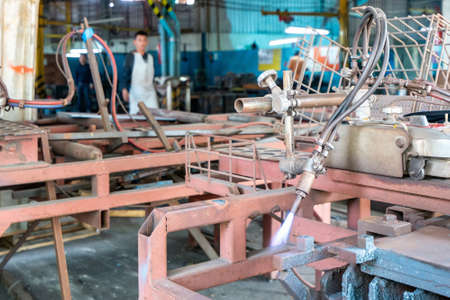 Close up torch or tip and blue flame form oxygen and acetylene of gas cutting machine for industrial...