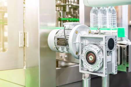 close up modern of gearbox and electric motor install at automatic bottle injection machine for...