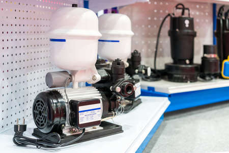 Close up high technology water jet pump with pressure tank for in industrial work on shelf