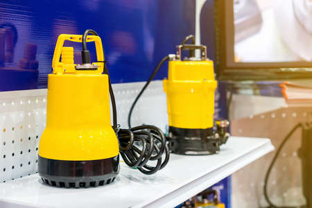 Close up vertical water pump (dip type) for high pressure in industrial work on shelf