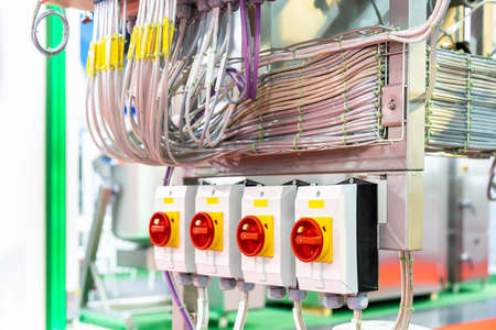 Close up switch breaker and wiring inside electrical control cabinet for industrial