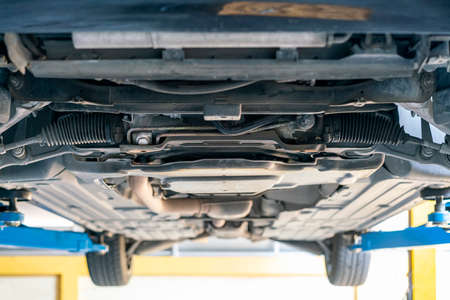 chassis bottom view and power steering rack and suspension system of saloon or sedan car at garage...