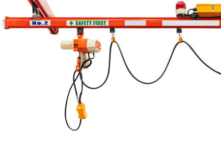 Overhead electric chain hoist with hook remote switch control isolated on white background with...
