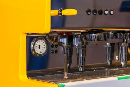 close up modern and automatic yellow color of coffee machineの写真素材