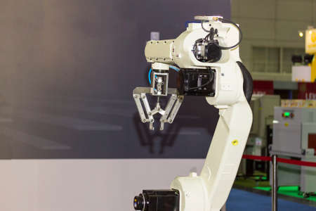 high technology and precision robot arm with grip for catch product  in manufacturing process
