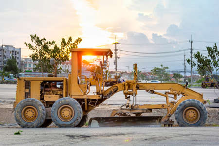 Large ground leveling machine or grader for road or street highway making park at work place with...