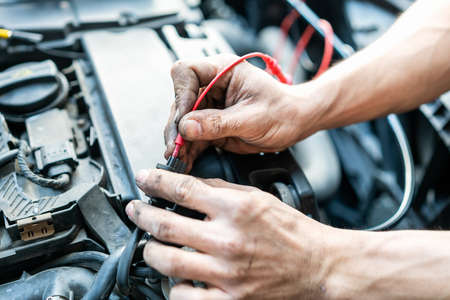 close up tool and hand of People or mechanic car repair during investigate cause of problem...